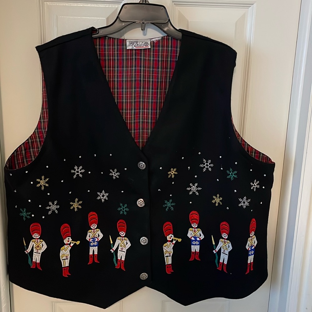 A black wool Christmas vest.